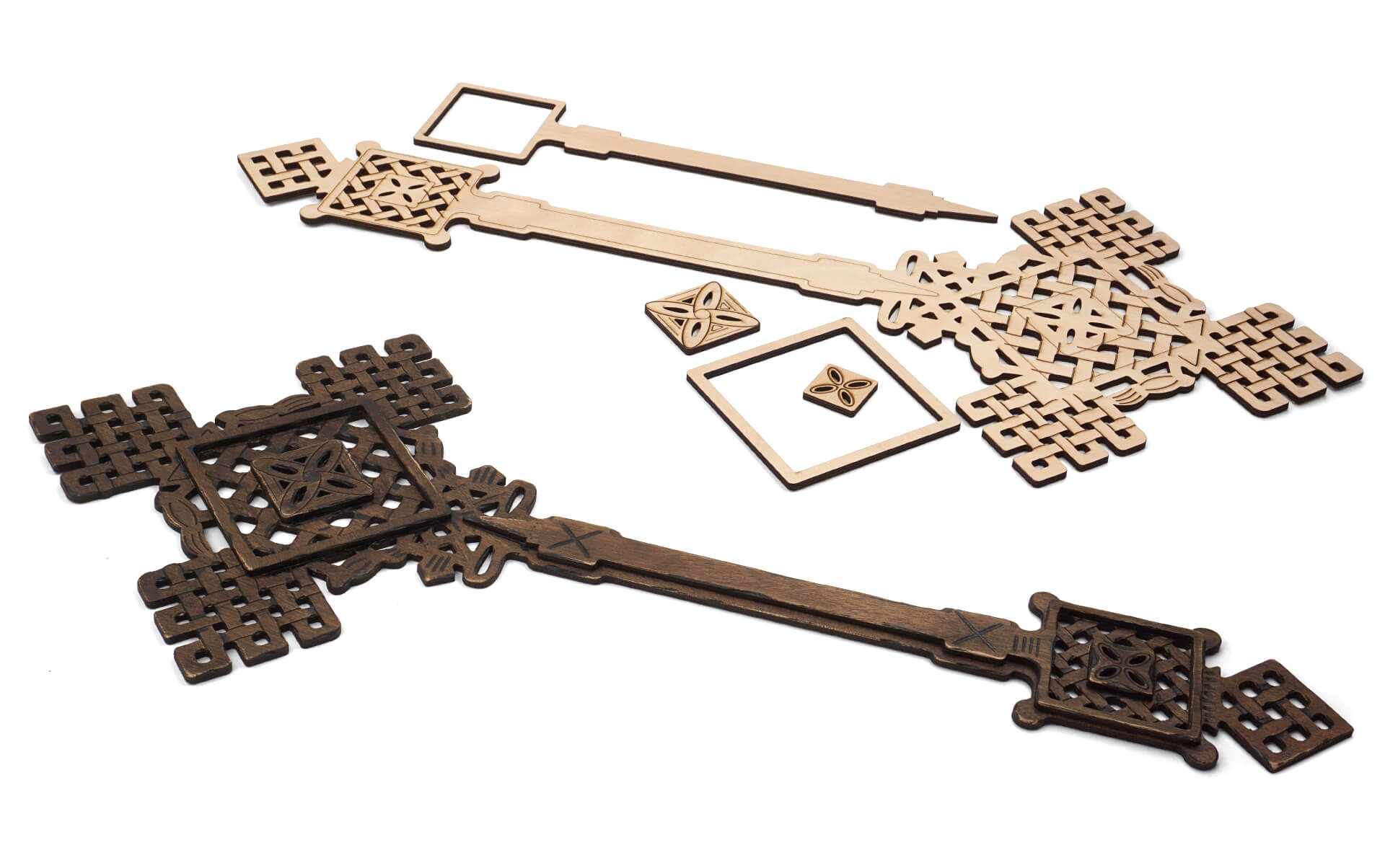 A detailed ethiopian cross made up of laser-cut layers of wood