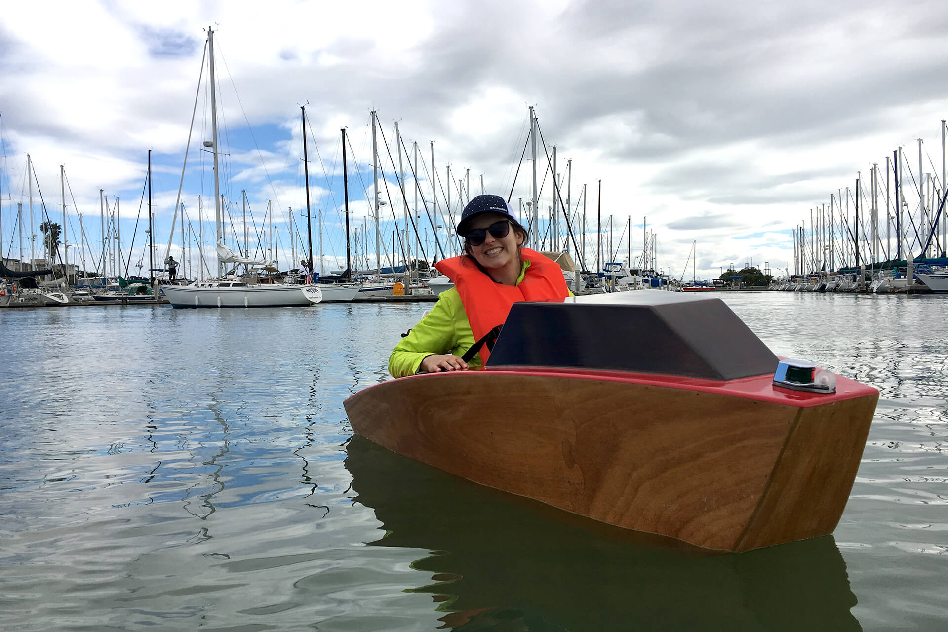 JuliAnn showing off the mini boat at the Emeryville harbor