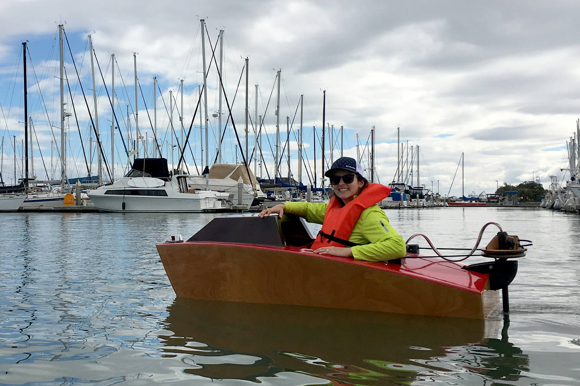 JuliAnn in a mini boat at the Emeryville harbor