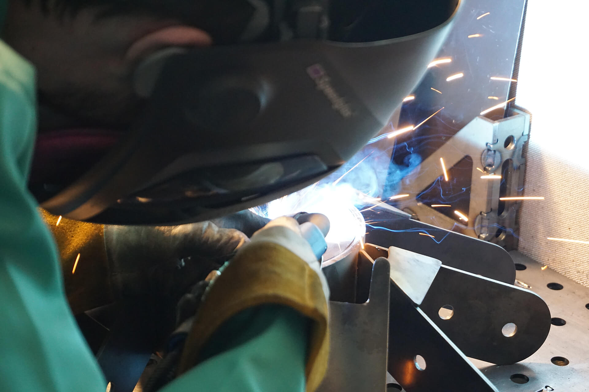 An in-action welding shot, closely cropped.